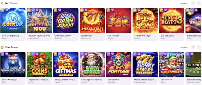 A grid featuring a mix of top and new slot games, including Coin UP: Lightning, Wild Cash X9990, Jingle Coins, and Starburst Galaxy, displayed with vibrant, game-themed graphics