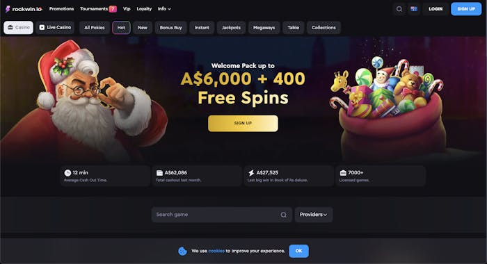 Rockwin casino homepage with a festive Santa and a sack full of gifts promoting a welcome pack of A$6,000 and 400 free spins. Icons below highlight cashout time, total cashout amounts, and the number of licensed games.